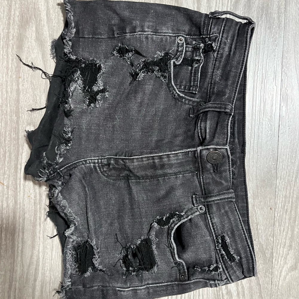 black ripped shorts